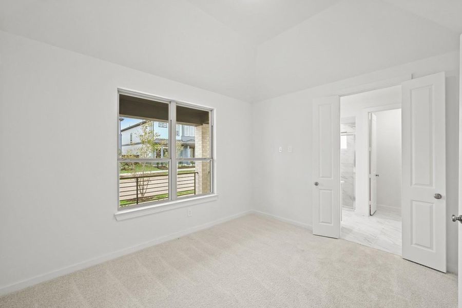 The primary bedroom features large windows that fill the space with natural light, creating a serene retreat for rest and relaxation. The primary bedroom features large windows that fill the space with natural light, creating a serene retreat for rest and relaxation.