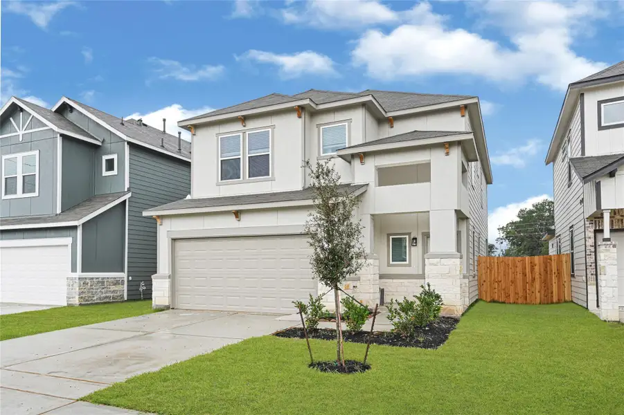 This modern two-story home features a clean exterior with stucco and stone accents. A two-car garage and double driveway greet you in. It's situated in a neatly maintained neighborhood with a small front yard and a wooden side fence providing privacy.Please note: The image is not the actual home; it is a home with the same floor plan in the neighborhood. Finishes may vary. This modern two-story home features a clean exterior with stucco and stone accents. A two-car garage and double driveway greet you in. It's situated in a neatly maintained neighborhood with a small front yard and a wooden side fence providing privacy.Please note: The image is not the actual home; it is a home with the same floor plan in the neighborhood. Finishes may vary.