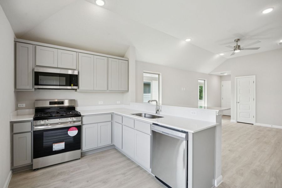 Kitchen in the Pine home plan by Trophy Signature Homes - REPRESENTATIVE PHOTO