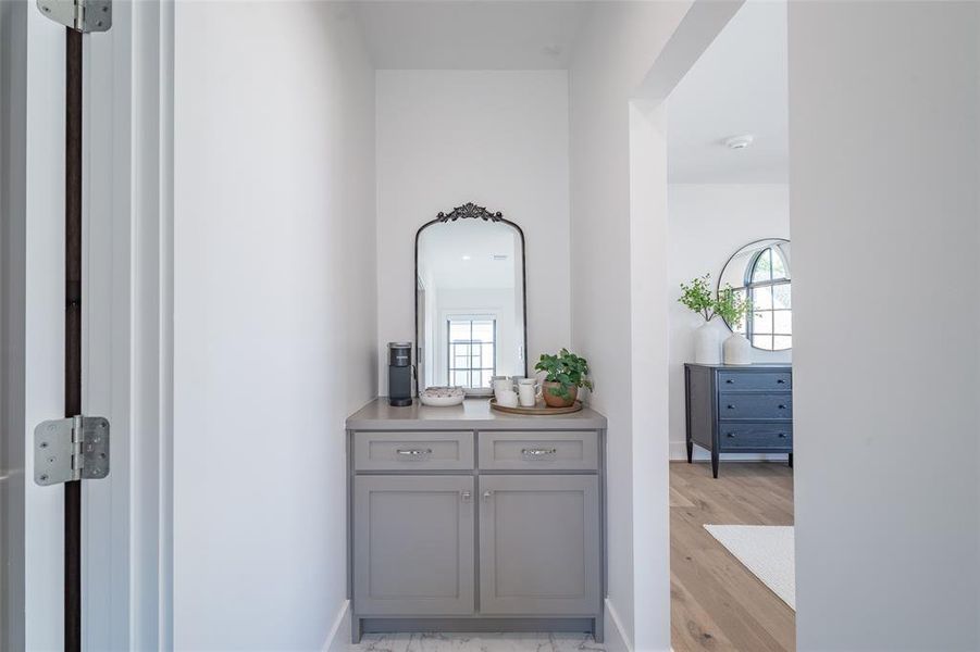 Coffee nook featuring plenty of natural light and light hardwood floors