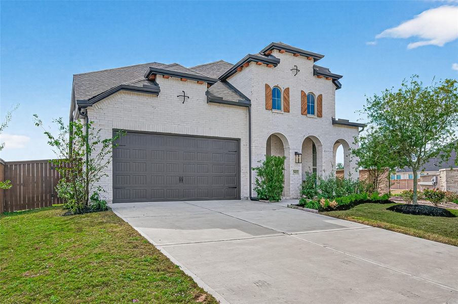 Front exterior of a new home in , Katy, TX, highlighting curb appeal (Image 1).