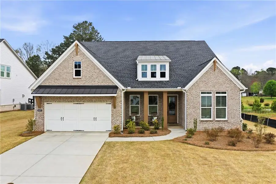 Front exterior of a new home in , Cumming, GA, highlighting curb appeal (Image 1). Front exterior of a new home in , Cumming, GA, highlighting curb appeal (Image 1).