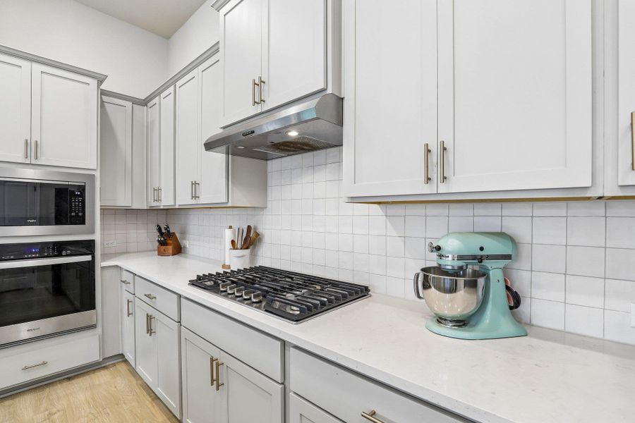 Culinary delights await in this bright kitchen with modern appliances and abundant cabinet space.