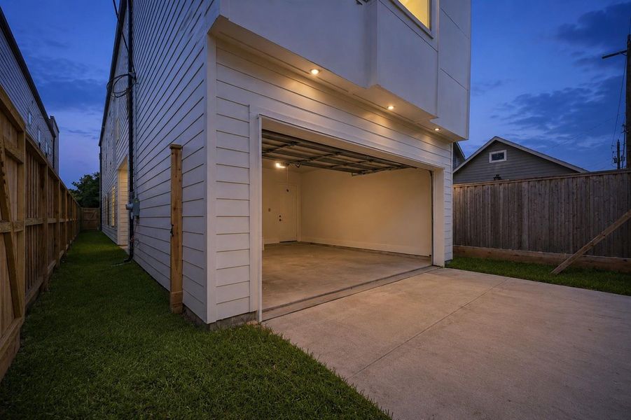 Alley access to the attached two-car garage helps maintain a cleaner front streetscape while adding everyday convenience. The rear-entry setup also creates a more open feel from the front approach to the home. Alley access to the attached two-car garage helps maintain a cleaner front streetscape while adding everyday convenience. The rear-entry setup also creates a more open feel from the front approach to the home.