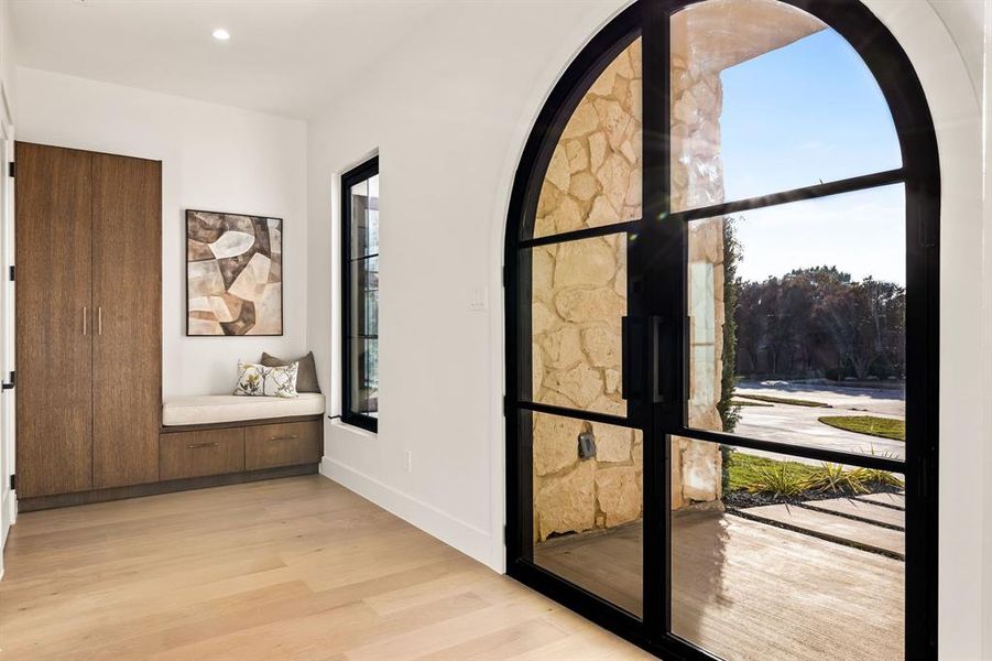 Hallway with light wood-style flooring and recessed lighting Hallway with light wood-style flooring and recessed lighting