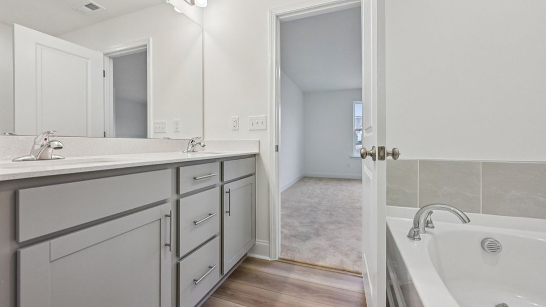 Furnished interior view inside a new home in Kensley Grove, Fuquay Varina (Image 14). Furnished interior view inside a new home in Kensley Grove, Fuquay Varina (Image 14).
