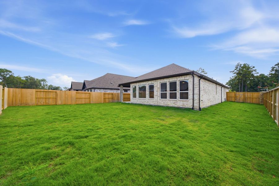 Exterior details and patio area of a home in The Highlands, Porter (Image 28).