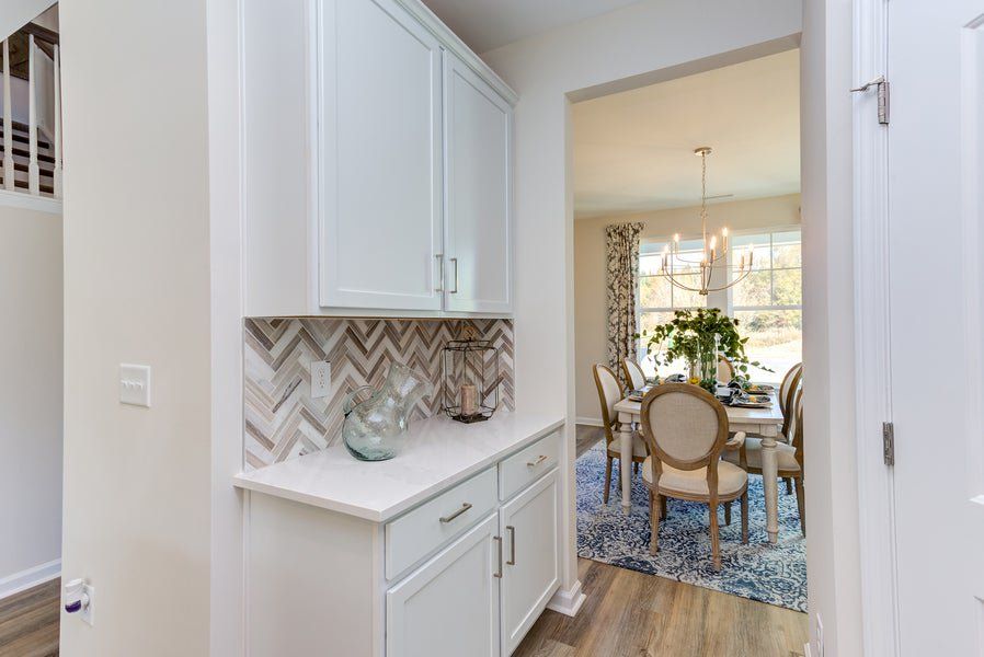 Representative furnished interior of a home built from the The Concerto by Chesapeake Homes in The Farm at Neill's Creek, Lillington (Image 15). Representative furnished interior of a home built from the The Concerto by Chesapeake Homes in The Farm at Neill's Creek, Lillington (Image 15).
