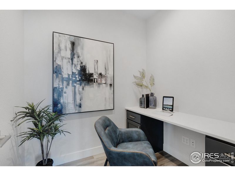 A unique pocket office right off the kitchen can serve many purposes: study, storage solution, wine vault, expanded pantry, etc.