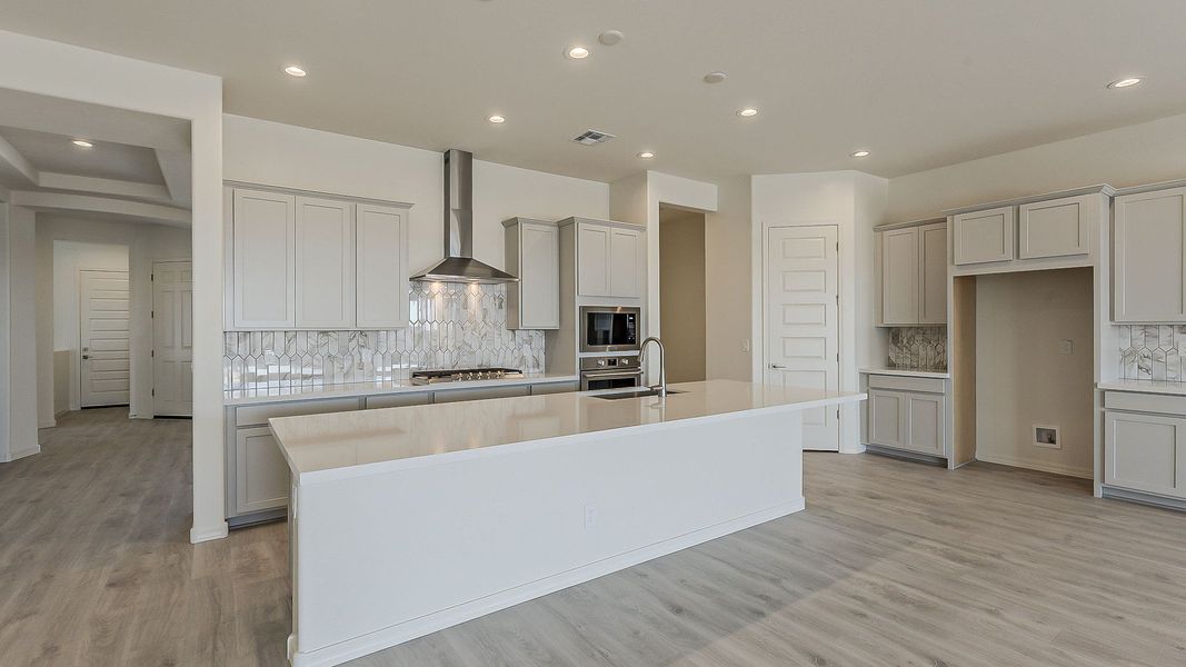 Furnished interior view inside a new home in Windrose, Waddell (Image 9).