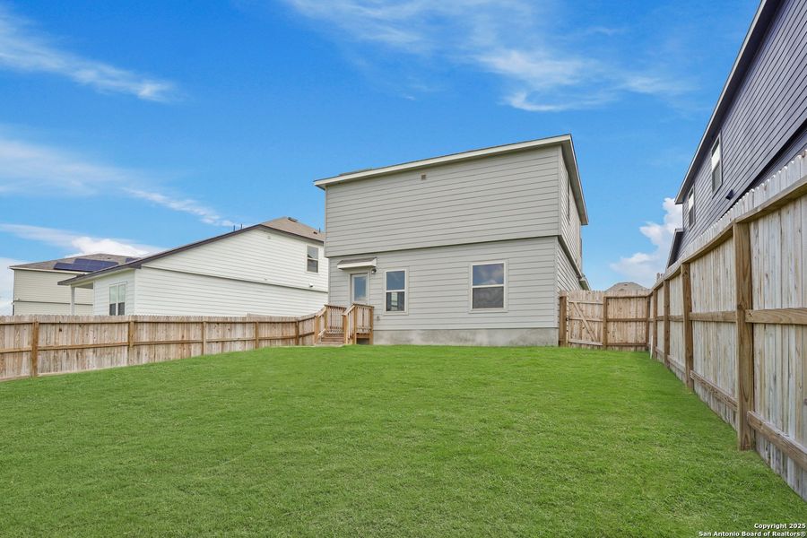 Front exterior of a new home in Cinco Lakes, San Antonio, TX, highlighting curb appeal (Image 27). Front exterior of a new home in Cinco Lakes, San Antonio, TX, highlighting curb appeal (Image 27).