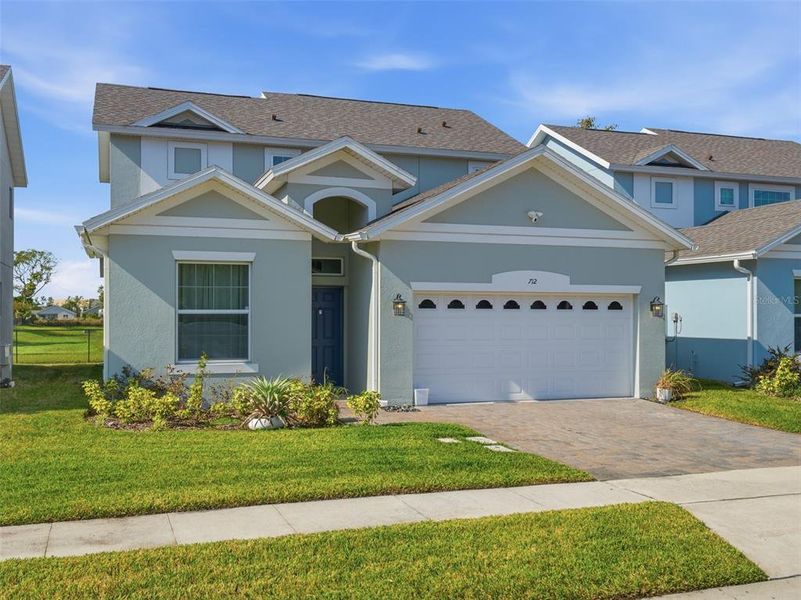Front exterior of a new home in Blue Diamond , Orlando, FL, highlighting curb appeal (Image 1). Front exterior of a new home in Blue Diamond , Orlando, FL, highlighting curb appeal (Image 1).
