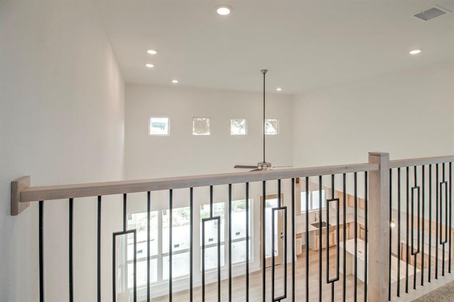 Detailed view of recessed lighting and a ceiling fan Detailed view of recessed lighting and a ceiling fan