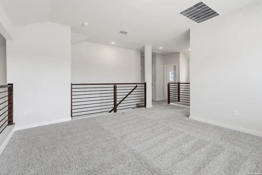 Spacious, unfurnished interior of a new home in Hunters Ranch, San Antonio (Image 24).