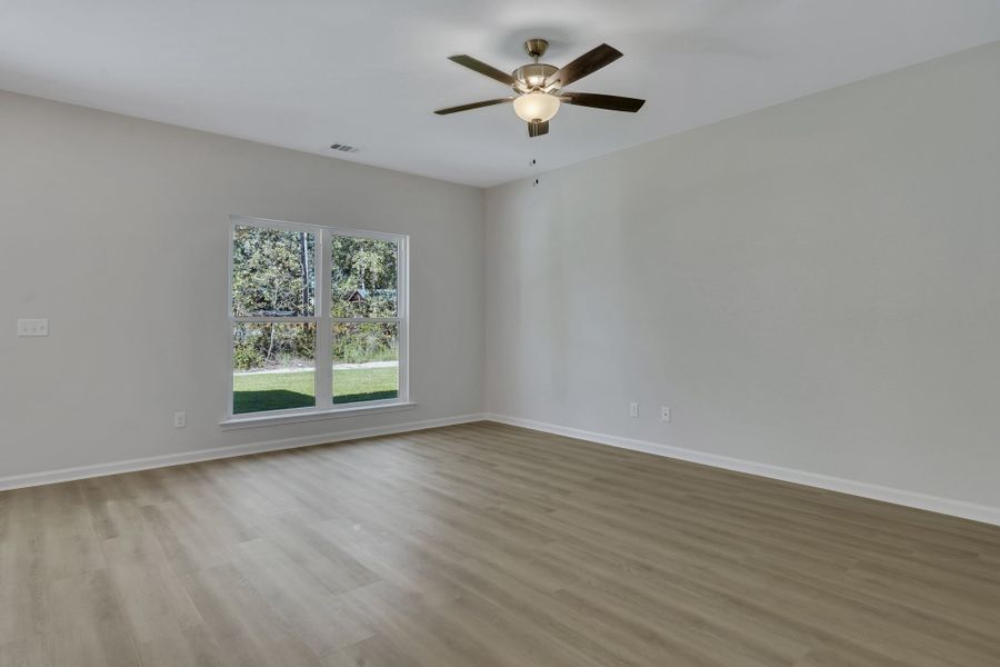 Representative unfurnished interior of a home built from the The Hatteras by Smith Family Homes in Ramsey Landing, Rincon (Image 20).