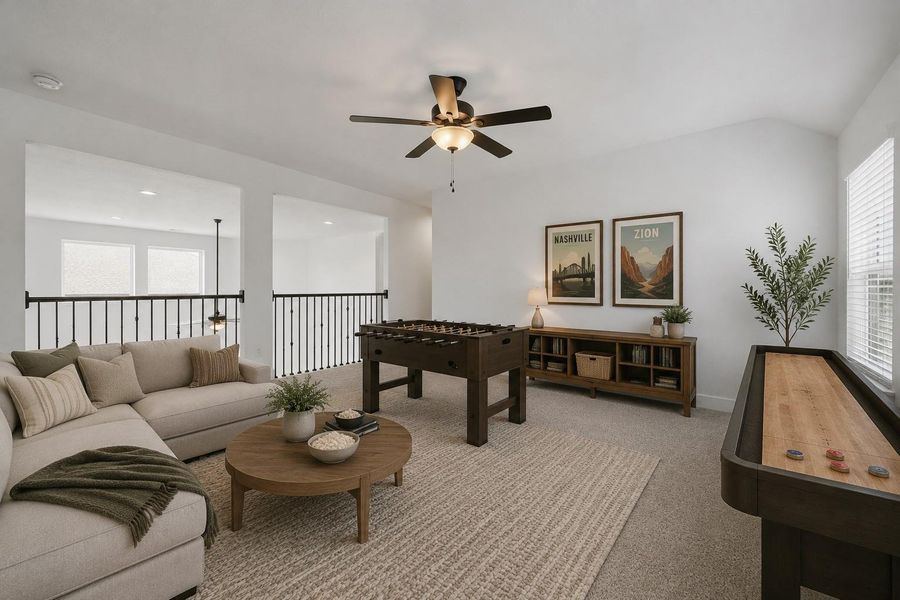 Upstairs you walk into a large game room that's perfect for a pool table, tv's, or a lounging space! *This photo has been virtually staged