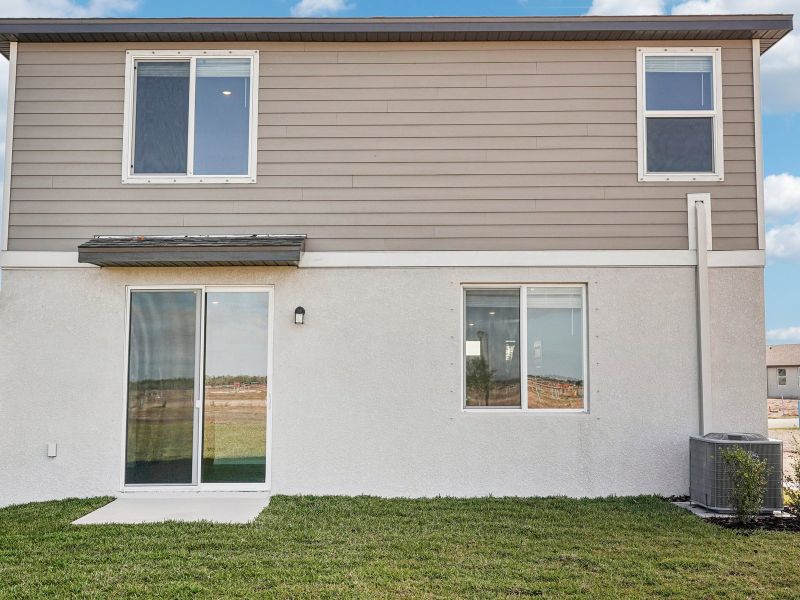 Exterior details and patio area of a home in Coasterra - Premier Series, Palmetto (Image 3).