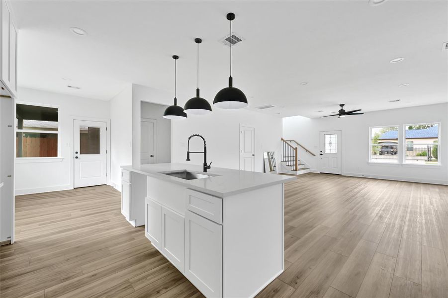 Island with pendant lighting and room for seating. Island with pendant lighting and room for seating.