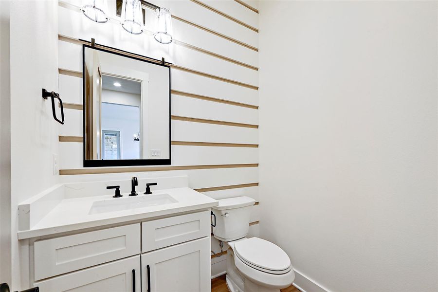 Half bath has eye catching ship lap walls.  4.5 baths in this home!