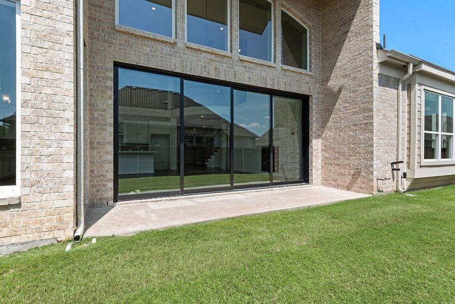 Front exterior of a new home in South Pointe, Mansfield, TX, highlighting curb appeal (Image 1).
