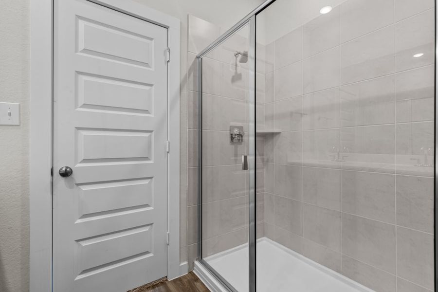 A shower with a glass door. A shower with a glass door.