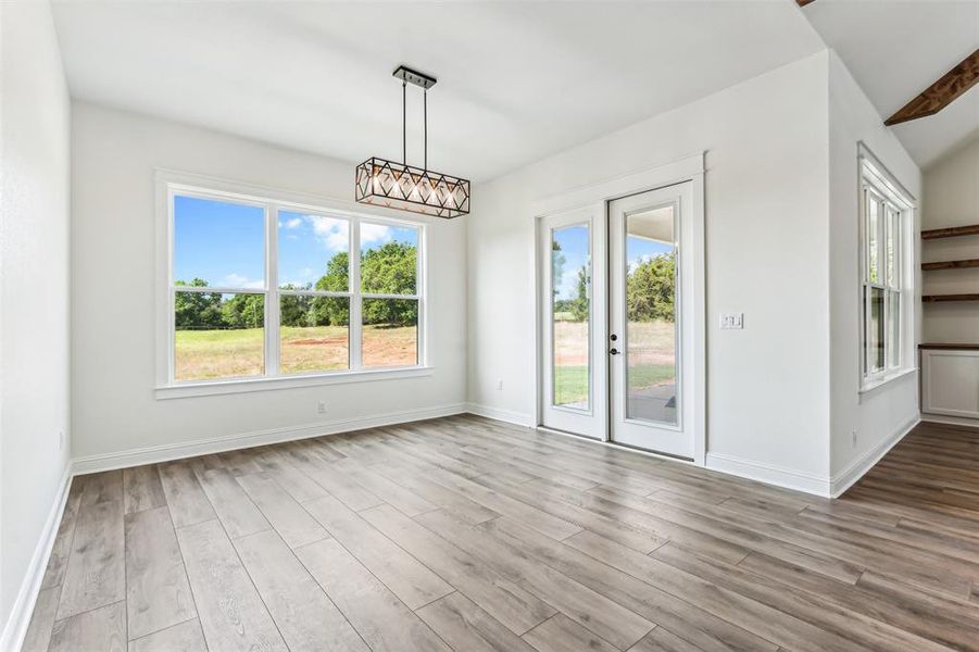 Unfurnished dining area featuring light wood-type flooring