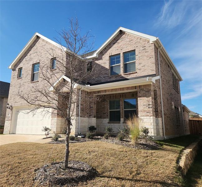 Front exterior of a new home in Ashford Park - Texana Series, Corinth, TX, highlighting curb appeal (Image 21).