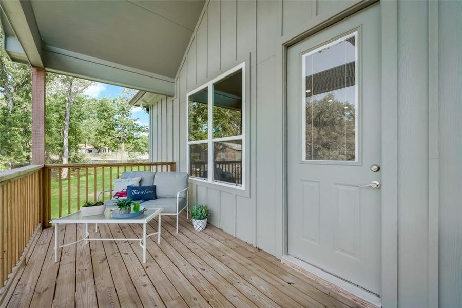 Unfurnished sunroom featuring lofted ceiling