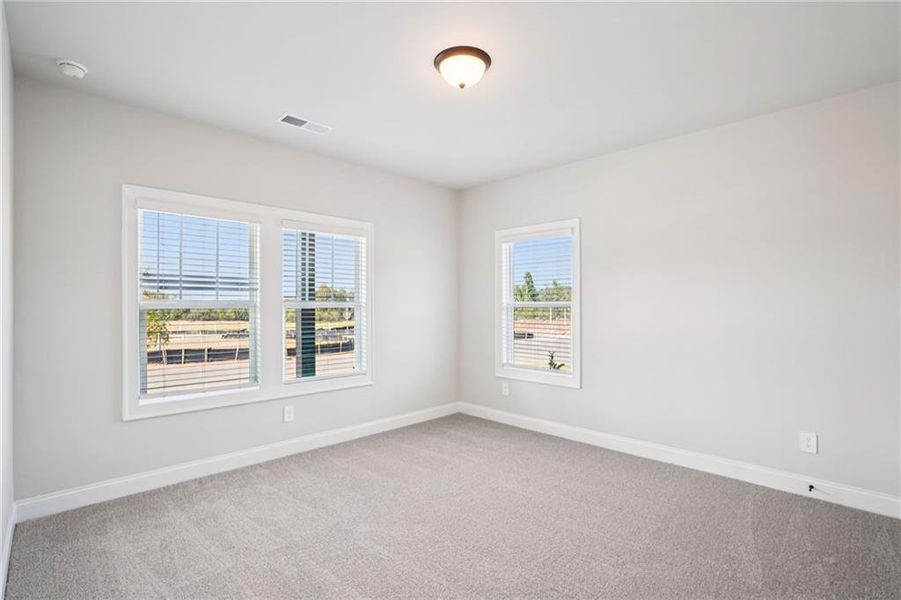 Spacious, unfurnished interior of a new home in Hemingway - Highland Series, Cumming (Image 35).