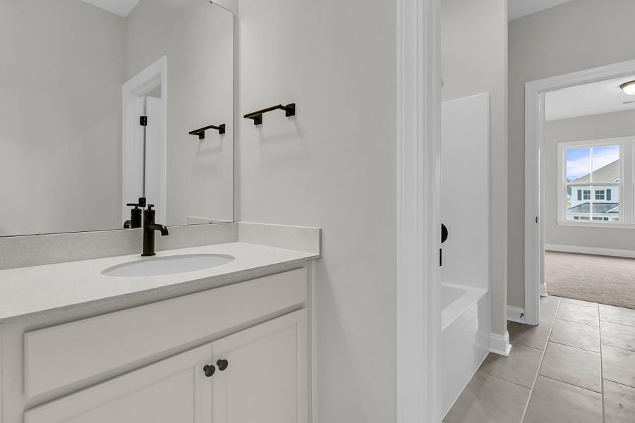Furnished interior view inside a new home in Tidewater at Lakes of Cane Bay, Summerville (Image 17).