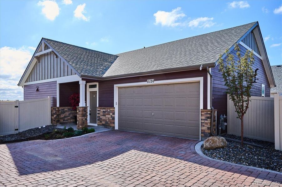 Front exterior of a new home in The Reserve, Aurora, CO, highlighting curb appeal (Image 20). Front exterior of a new home in The Reserve, Aurora, CO, highlighting curb appeal (Image 20).