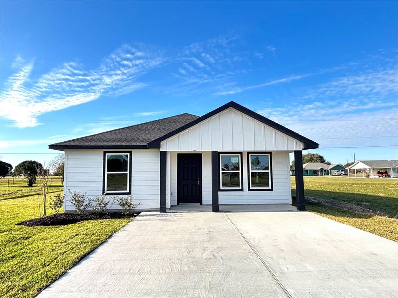 Front exterior of a new home in , Palacios, TX, highlighting curb appeal (Image 2). Front exterior of a new home in , Palacios, TX, highlighting curb appeal (Image 2).