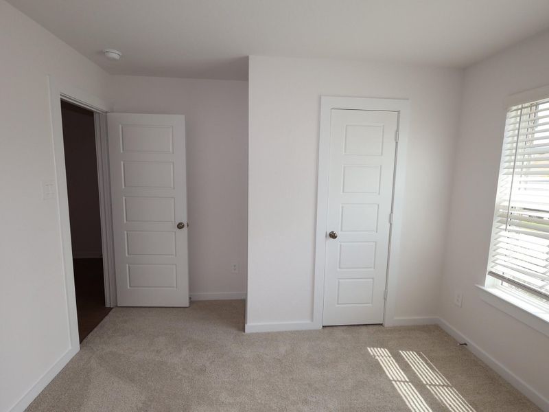 Spacious, unfurnished interior of a new home in Pinewood at Grand Texas, New Caney (Image 21).