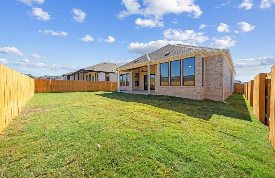 Exterior details and patio area of a home in 6 Creeks, Kyle (Image 16).