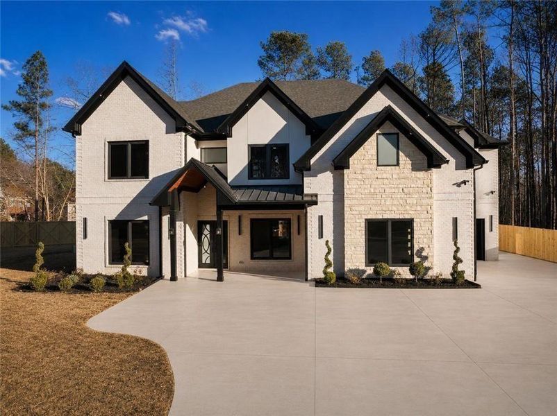 Front exterior of a new home in , Lawrenceville, GA, highlighting curb appeal (Image 27). Front exterior of a new home in , Lawrenceville, GA, highlighting curb appeal (Image 27).