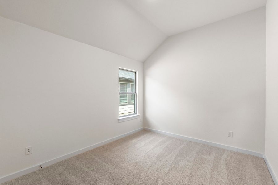 Bedroom in the Quartz home plan by Trophy Signature Homes – REPRESENTATIVE PHOTO
