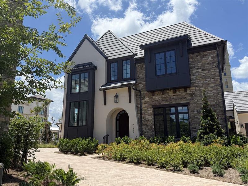 Front exterior of a new home in , Orlando, FL, highlighting curb appeal (Image 27).