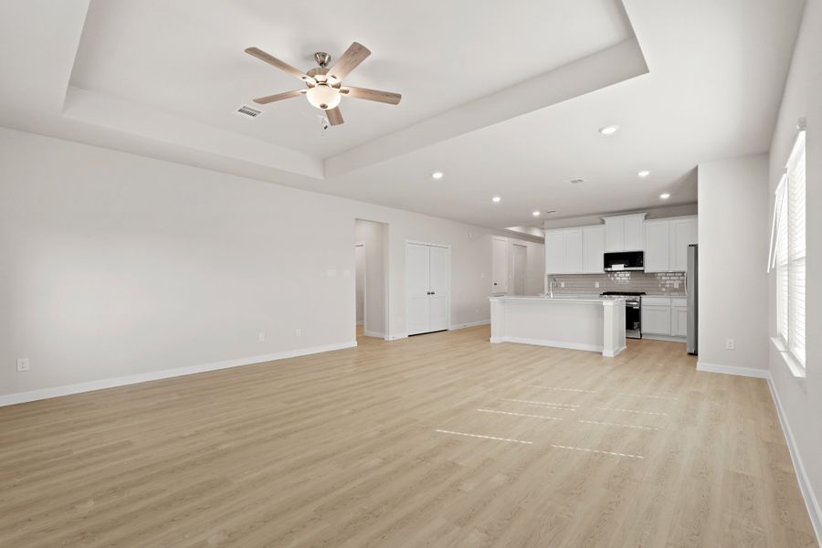 A large kitchen with white walls. A large kitchen with white walls.