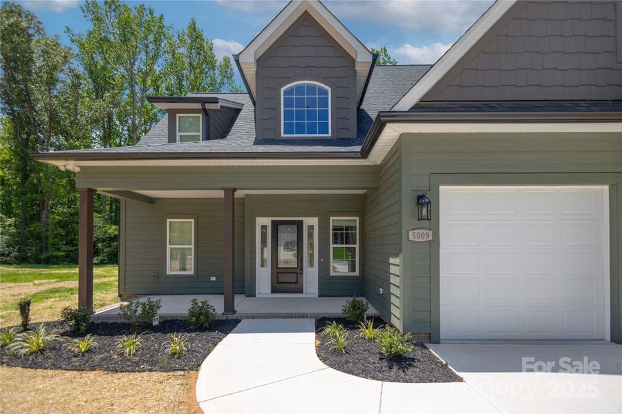 Front exterior of a new home in , Stanley, NC, highlighting curb appeal (Image 25).