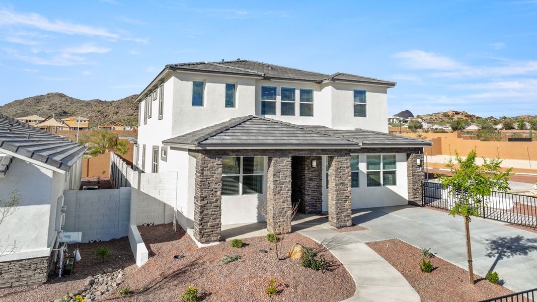 Front exterior of a new home in Aloravita, Peoria, AZ, highlighting curb appeal (Image 25).