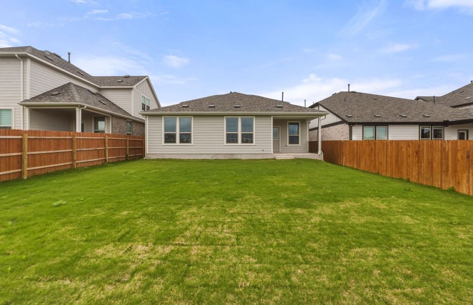 Exterior details and patio area of a home in Saddleback at Santa Rita Ranch, Liberty Hill (Image 25).