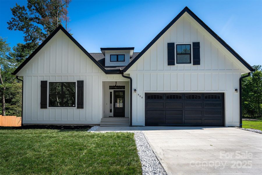 Front exterior of a new home in , Hendersonville, NC, highlighting curb appeal (Image 32).