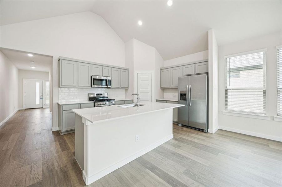 Kitchen in the Claret home plan by Trophy Signature Homes – REPRESENTATIVE PHOTO