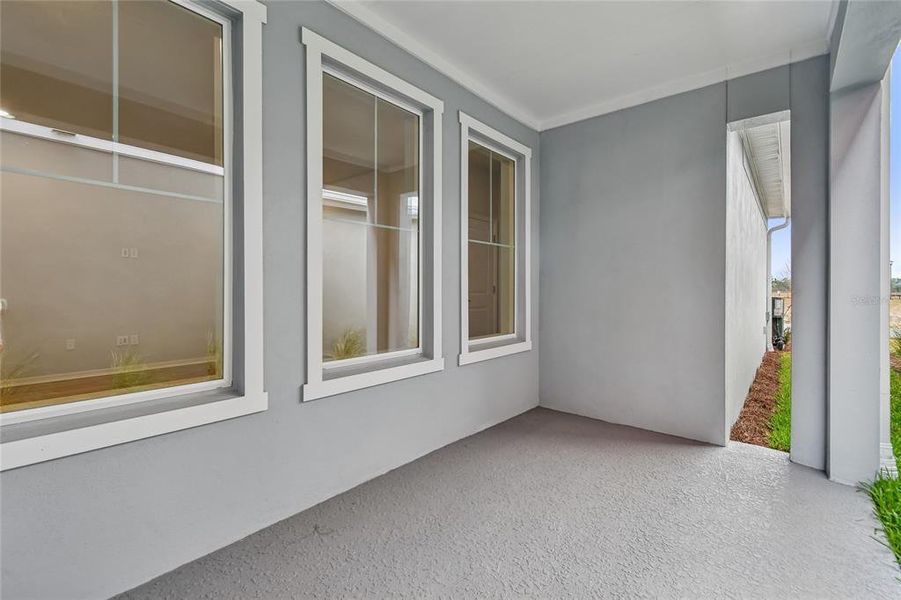 Exterior details and patio area of a home in Laureate Park at Lake Nona - Garden Series, Orlando (Image 3).