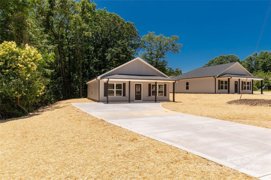 Front exterior of a new home in , Clover, SC, highlighting curb appeal (Image 15).