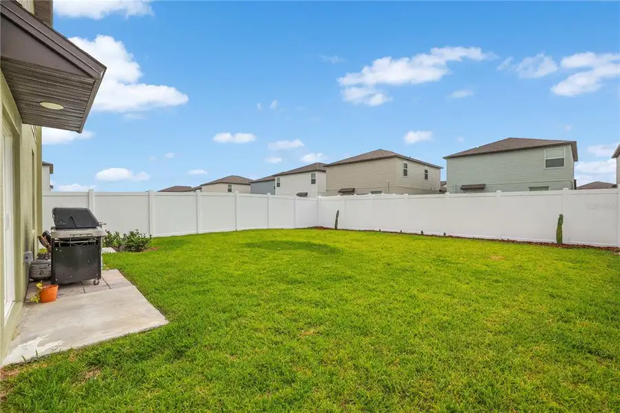 Exterior details and patio area of a home in Cypress Point at Lake Parker, Lakeland (Image 4).