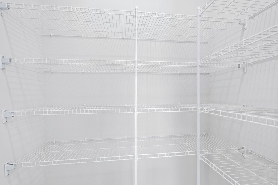 A walk-in kitchen pantry offers an abundance of space. A walk-in kitchen pantry offers an abundance of space.