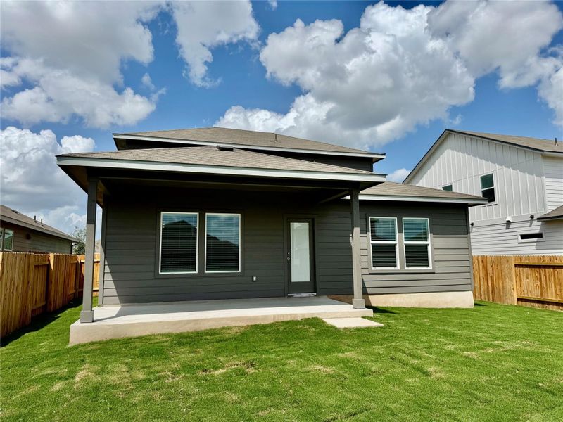 Rear view of house featuring a patio area, a fenced backyard, and roof with shingles Rear view of house featuring a patio area, a fenced backyard, and roof with shingles