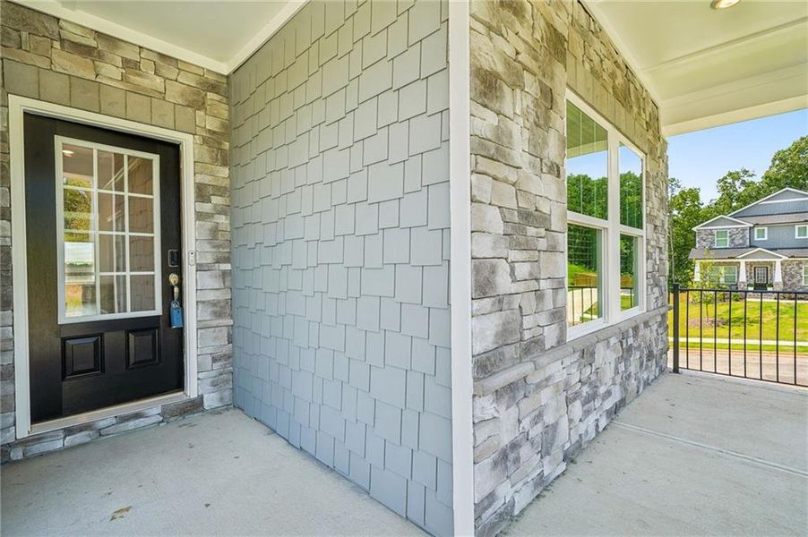 Exterior details and patio area of a home in River Pointe, Monroe (Image 28).