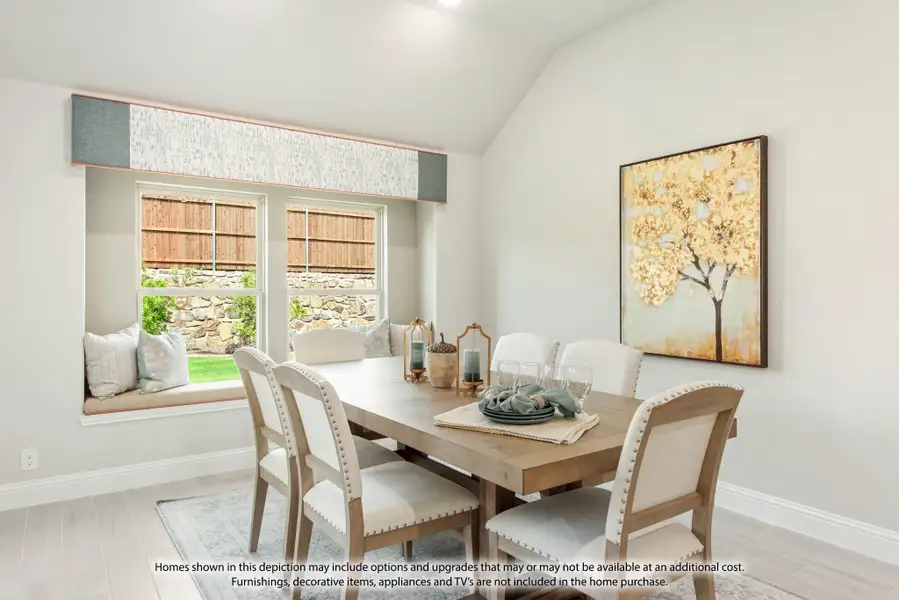 Dining room with wood table, six upholstered chairs, window seat, and vaulted ceiling Dining room with wood table, six upholstered chairs, window seat, and vaulted ceiling